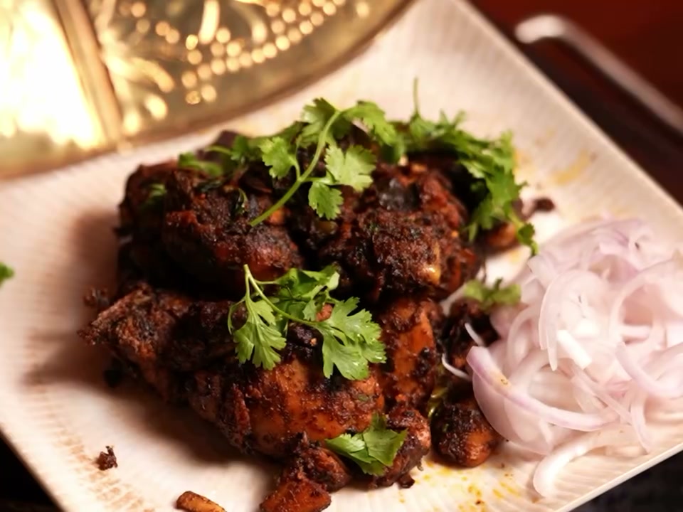 Guntur kodi vepudu, dark spiced chicken fry with coriander and sliced onions